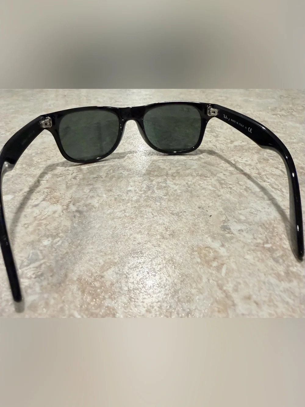 Ray-Ban RB9035S Kids sunglasses featuring a black frame and distinctive green